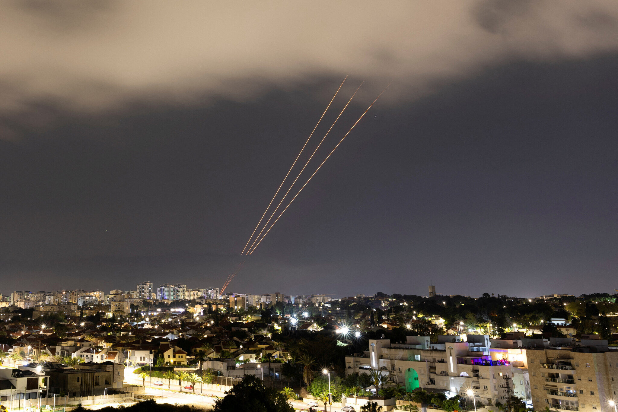 Iranian missiles streak across the sky toward Israel during one of the direct exchanges in 2024 that broke the long-standing shadow-war convention.