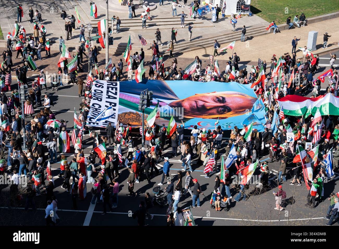 Supporters carry a large portrait of Reza Pahlavi during a 2026 rally in Washington — visual evidence of the movement’s mobilising capacity abroad, even as polling shows a more complex picture inside Iran.