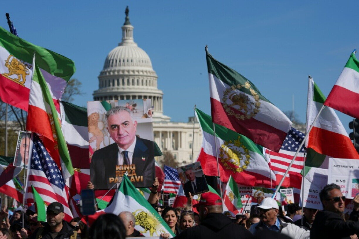 Supporters wave Lion and Sun flags and hold portraits of Reza Pahlavi near the U.S. Capitol — a visible example of the diaspora mobilising power the movement has repeatedly demonstrated, even as domestic organisation and coalition-building remain its clearest weaknesses.